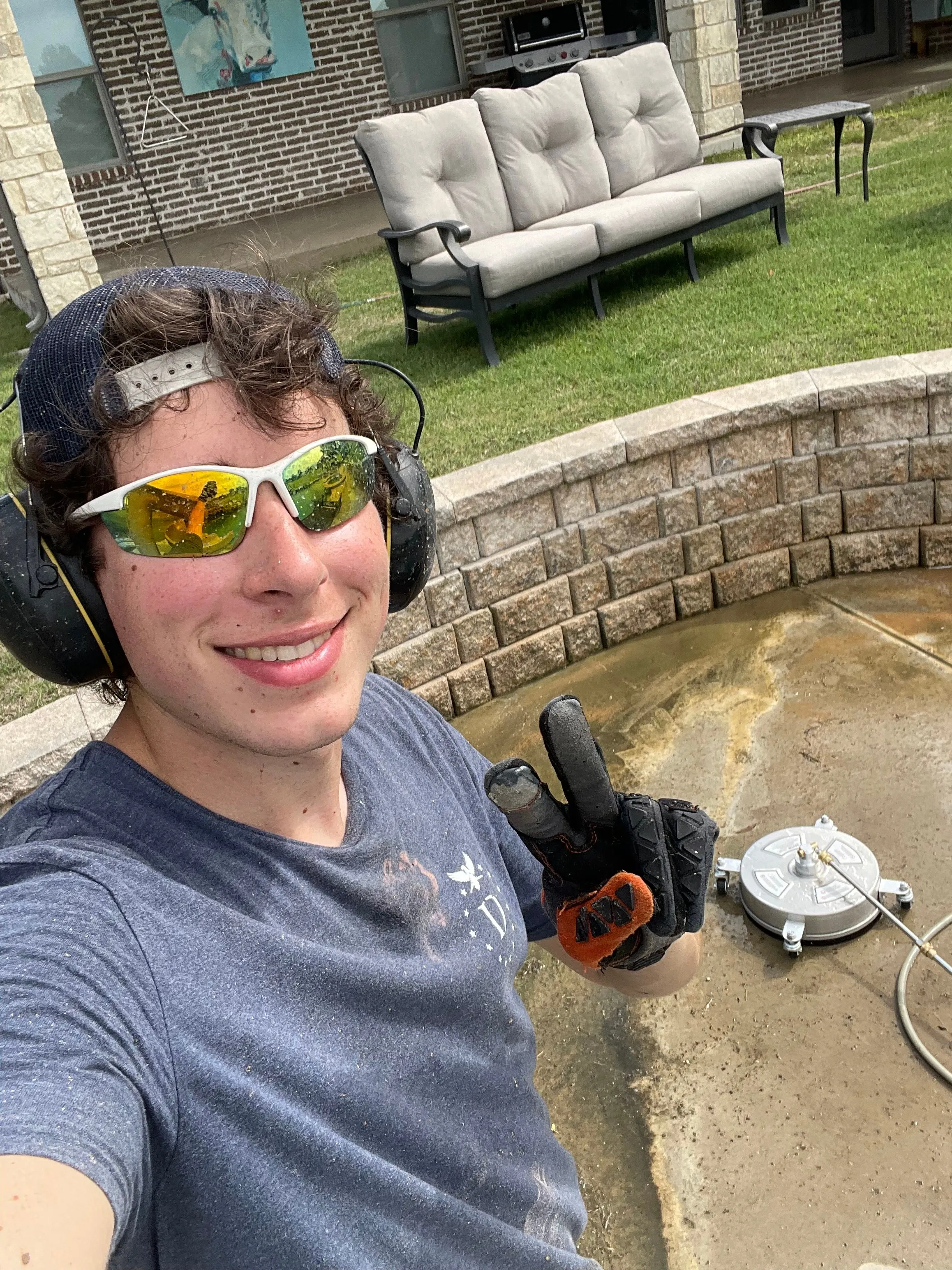Ashton McMullin, owner of Revival Co. Powerwashing, on the job in Wylie, TX
