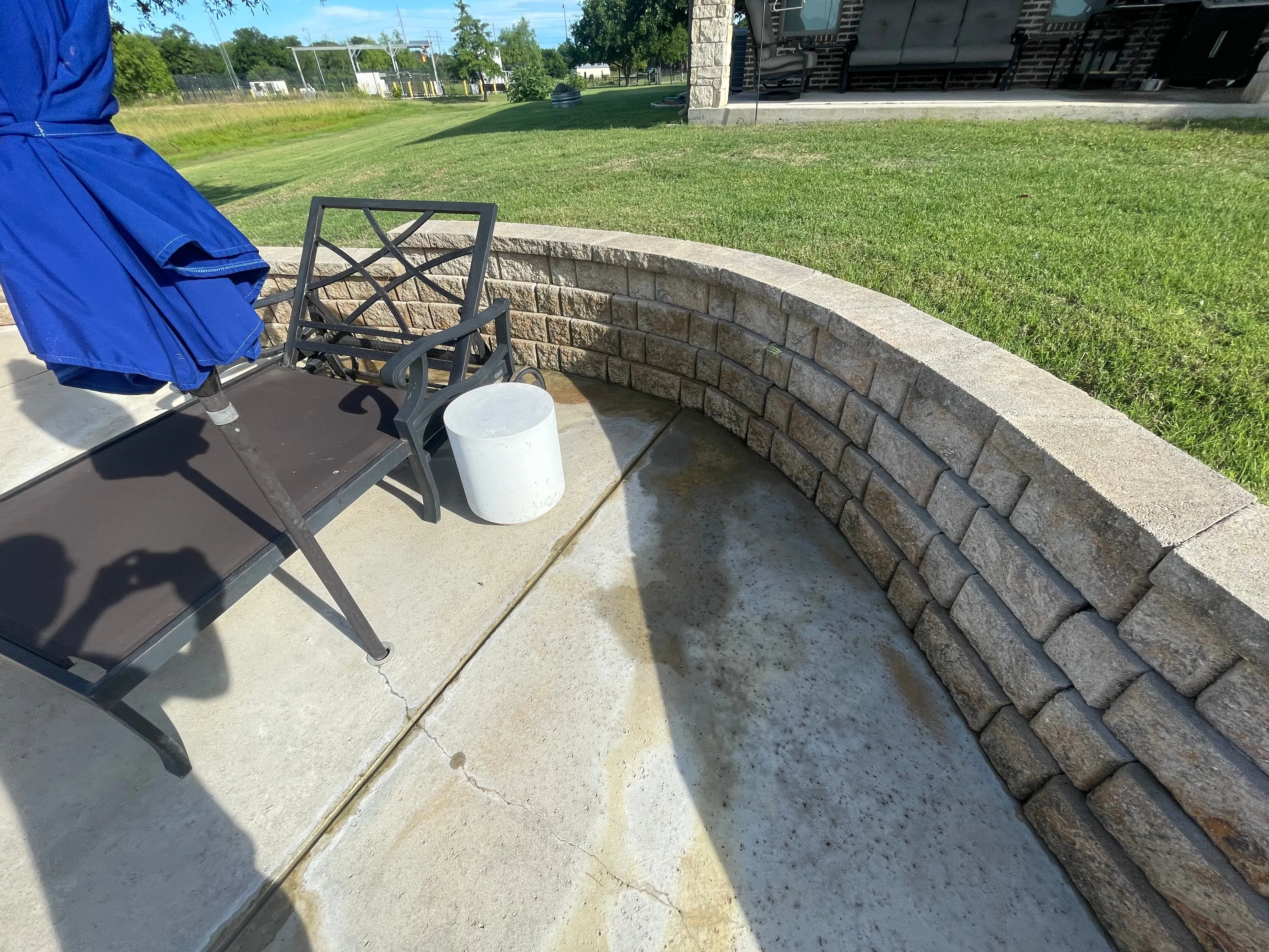 The same patio concrete cleaned bright and fresh after power washing in Wylie, TX