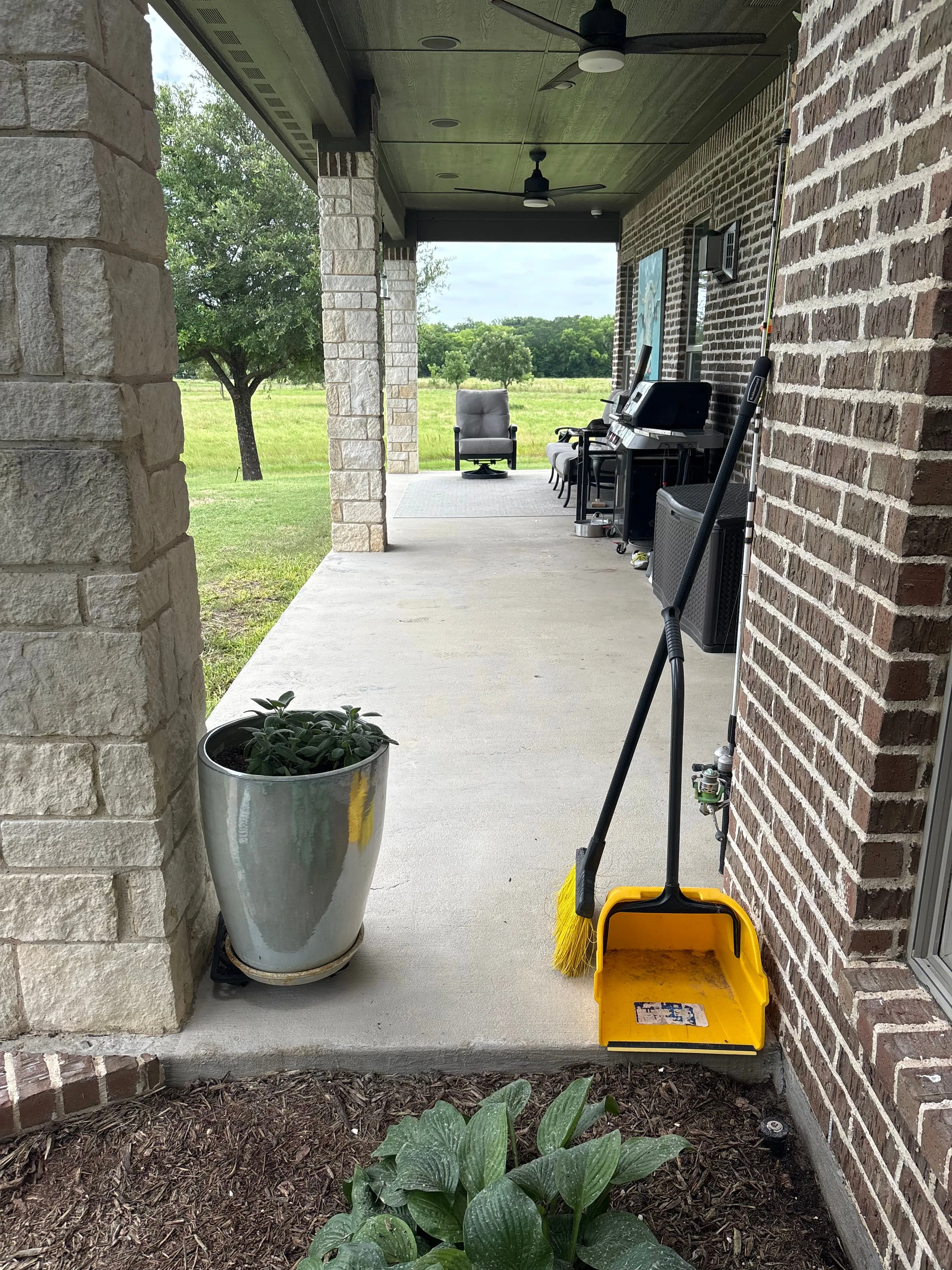 The same covered patio with clean, bright concrete after power washing in Wylie, TX